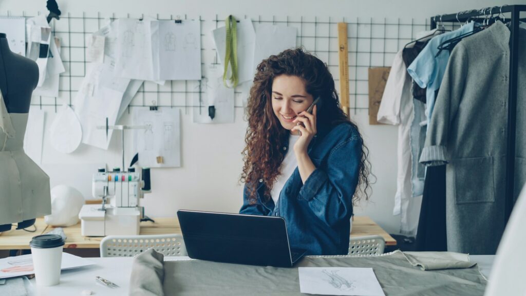 Small business owner on the phone at her laptop