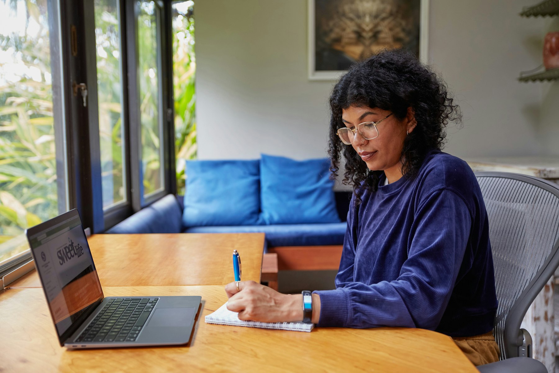 Woman working on a laptop at home